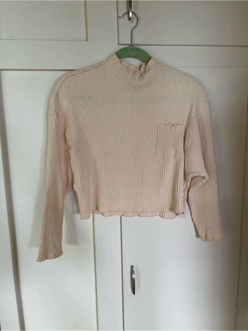 Billabong Ribbed Mock-Neck Long Sleeve Crop Top in Cream/butter color